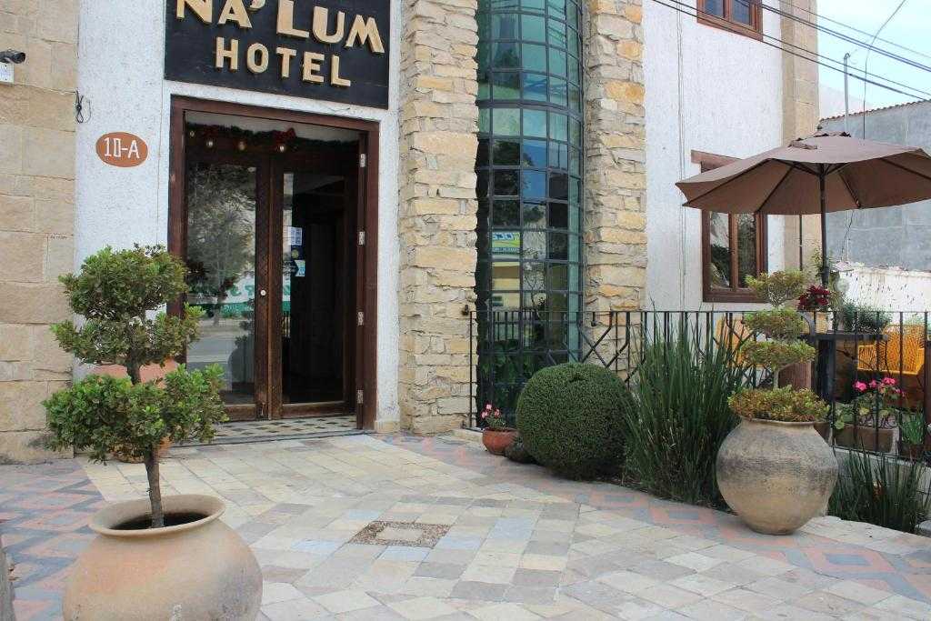 Entrance of Hotel Na´Lum with stonework and courtyard plants