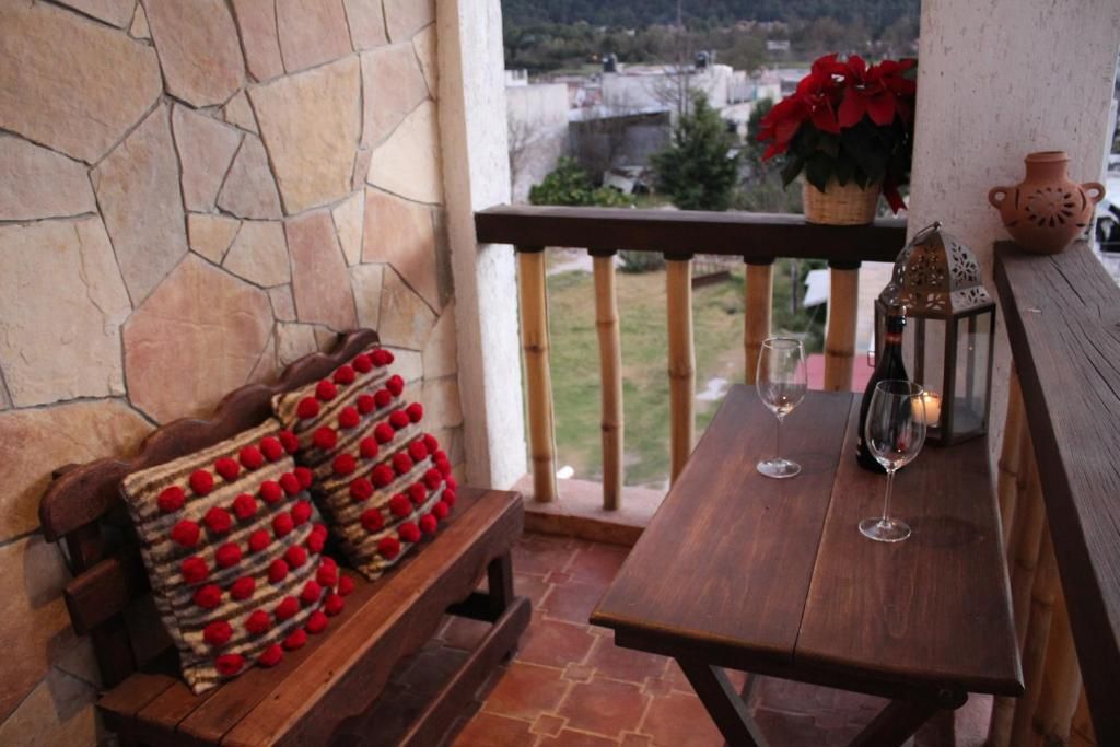 Hotel Na´Lum balcony seating with traditional textiles